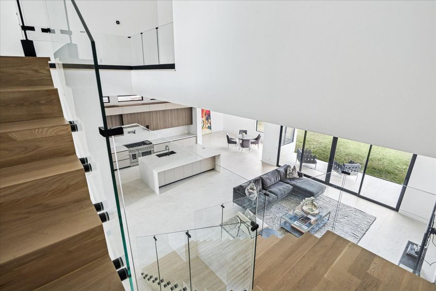 The staircase offers views of the living and kitchen area.