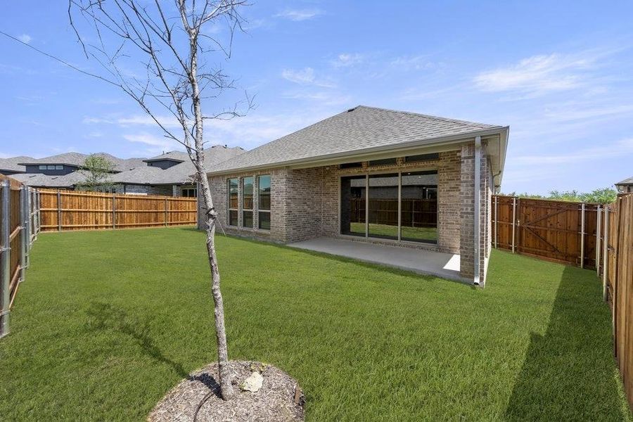 Front exterior of a new home in Valencia on The Lake, Little Elm, TX, highlighting curb appeal (Image 22). Front exterior of a new home in Valencia on The Lake, Little Elm, TX, highlighting curb appeal (Image 22).