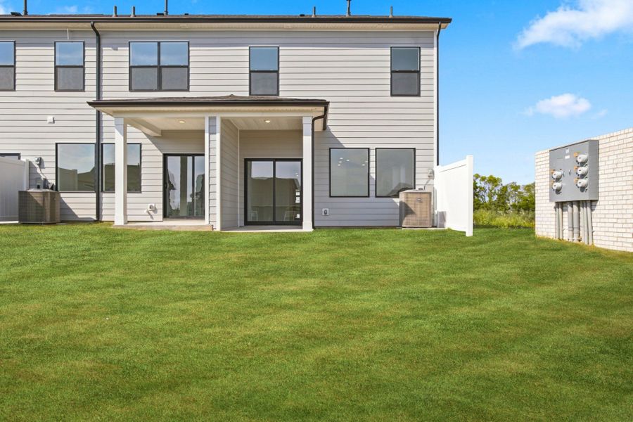 Exterior details and patio area of a home in Nexus Townhomes, Gallatin (Image 3).