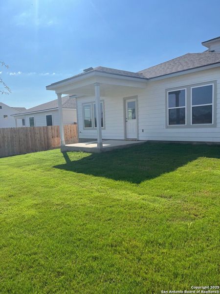 Front exterior of a new home in The Meadows at Hunters Ranch, San Antonio, TX, highlighting curb appeal (Image 5). Front exterior of a new home in The Meadows at Hunters Ranch, San Antonio, TX, highlighting curb appeal (Image 5).