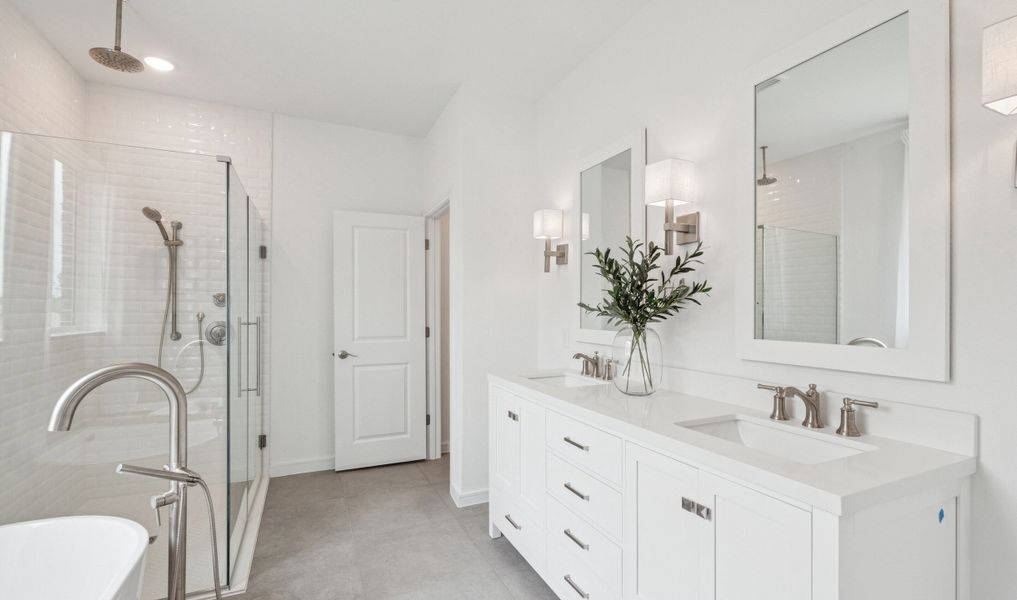 Primary bath with glass shower enclosure & brushed nickel accents Primary bath with glass shower enclosure & brushed nickel accents