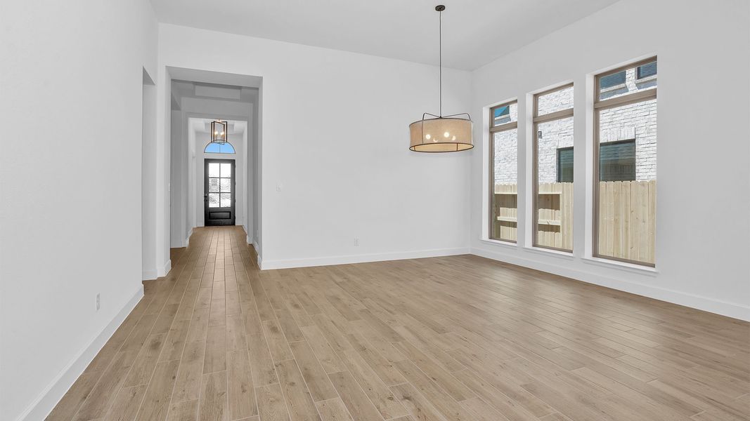 Spacious, unfurnished interior of a new home in Lakes of Cane Island, Katy (Image 61).