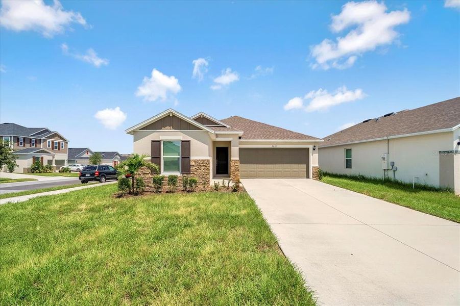 Front exterior of a new home in , Davenport, FL, highlighting curb appeal (Image 23). Front exterior of a new home in , Davenport, FL, highlighting curb appeal (Image 23).