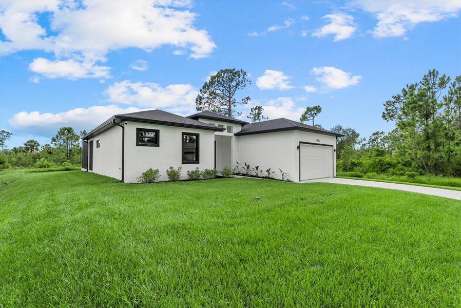 Front exterior of a new home in , Port Charlotte, FL, highlighting curb appeal (Image 31). Front exterior of a new home in , Port Charlotte, FL, highlighting curb appeal (Image 31).