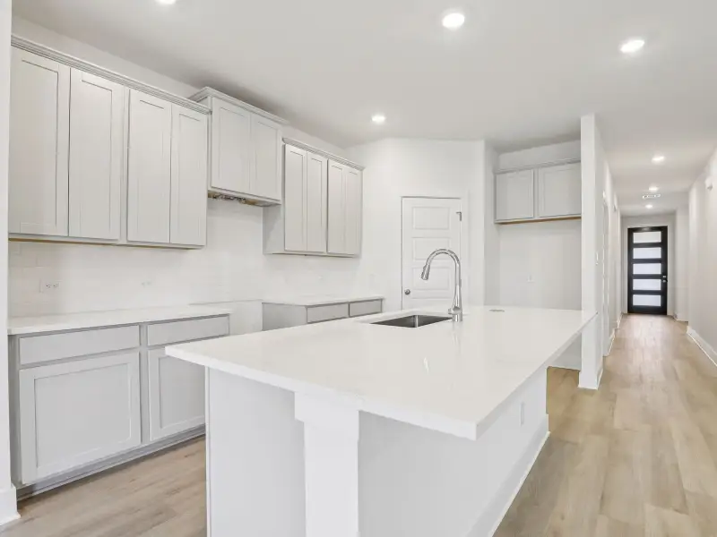 Kitchen & entry in the Callaghan floorplan at a Meritage Homes community.