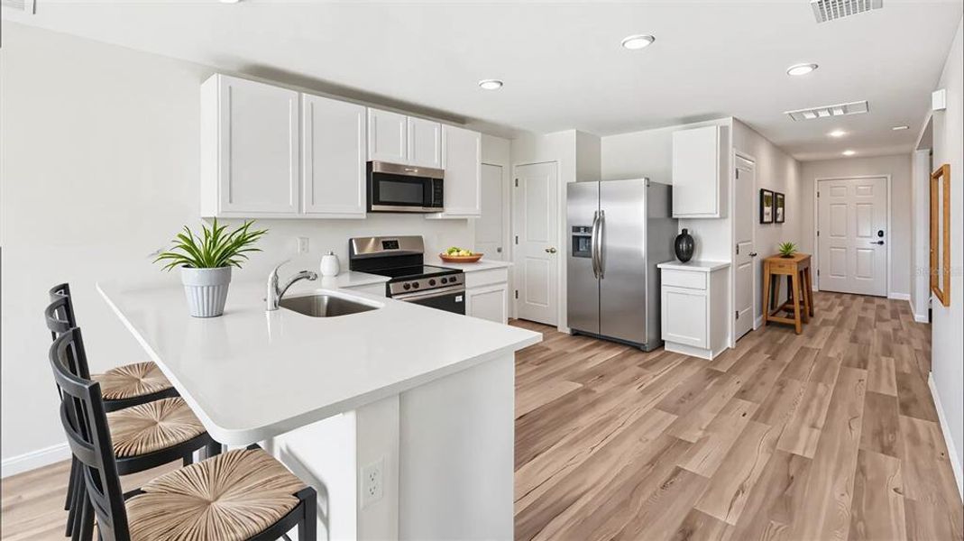 Furnished interior view inside a new home in Hernando County Spot Lots, Spring Hill (Image 8).