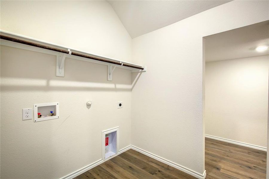 Laundry area with hookup for a gas dryer, dark wood finished floors, electric dryer hookup, and washer hookup