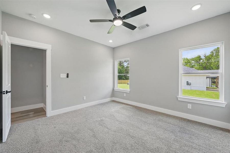 Empty room with baseboards, a ceiling fan, carpet, recessed lighting, and a smoke detector
