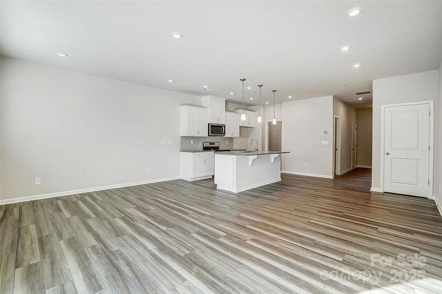 Gathering Space with View of Kitchen and Breakfast Area-Photo Similar to Subject Property