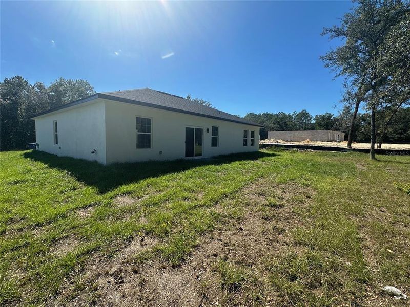 Exterior details and patio area of a home in , Citrus Springs (Image 4).