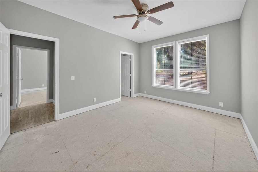 Unfurnished bedroom featuring ceiling fan and baseboards