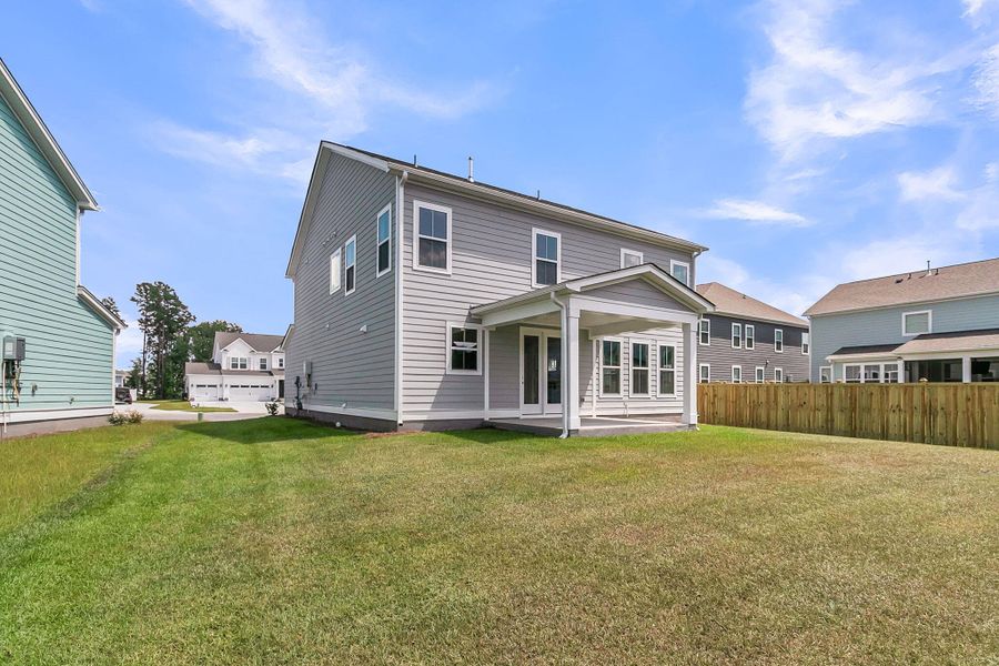 Front exterior of a new home in Tidewater at Lakes of Cane Bay, Summerville, SC, highlighting curb appeal (Image 2).