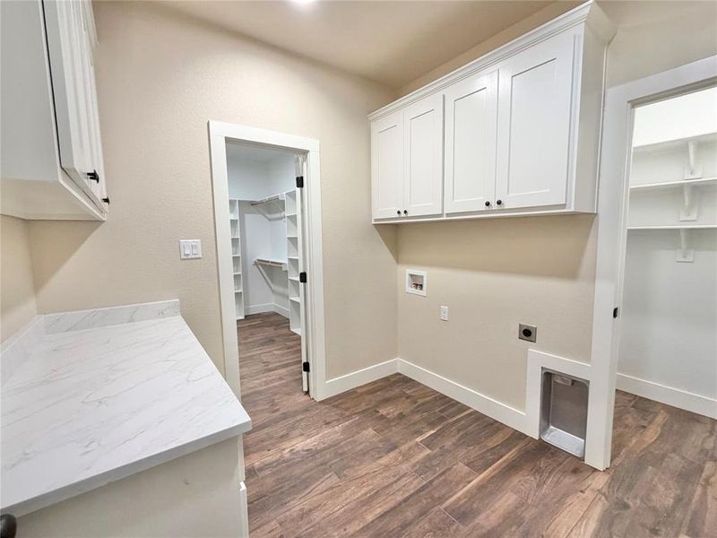 Master closet leads directly from master bath and into utility room with tons of storage!