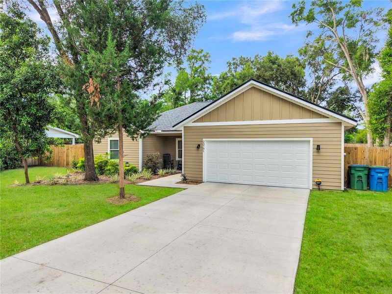 Front exterior of a new home in , High Springs, FL, highlighting curb appeal (Image 1). Front exterior of a new home in , High Springs, FL, highlighting curb appeal (Image 1).