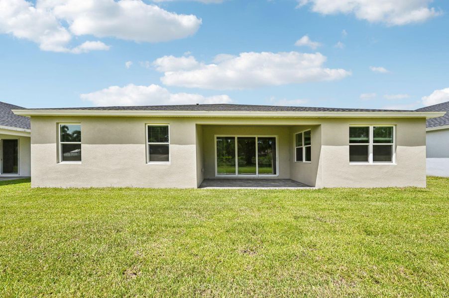 Exterior details and patio area of a home in Hampton Park - Signature Series, Vero Beach (Image 24).
