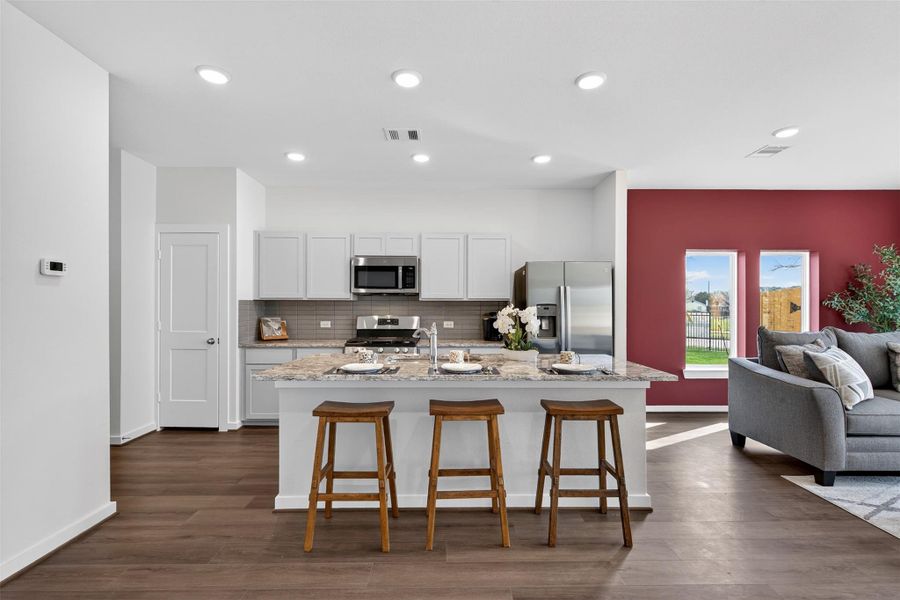 Spacious kitchen layout centered around a large island with bar seating, offering both functionality and a natural gathering space. Spacious kitchen layout centered around a large island with bar seating, offering both functionality and a natural gathering space.