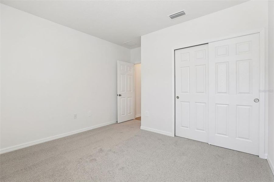 Spacious, unfurnished interior of a new home in Bradbury Creek - Signature Series, Haines City (Image 24).