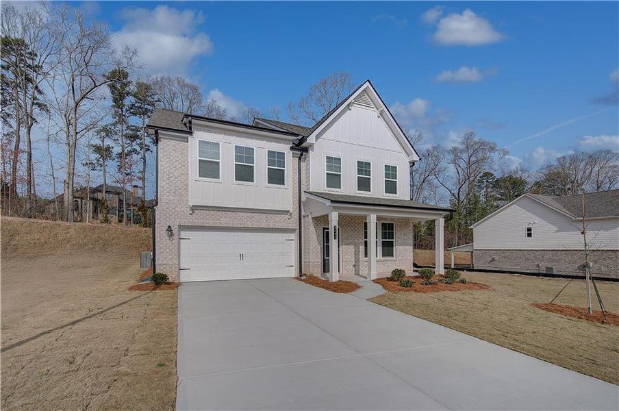 Front exterior of a new home in Hamilton Lakes, Lawrenceville, GA, highlighting curb appeal (Image 14). Front exterior of a new home in Hamilton Lakes, Lawrenceville, GA, highlighting curb appeal (Image 14).