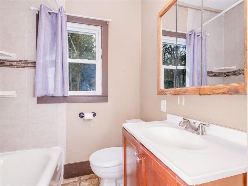 Bath has tub shower combination