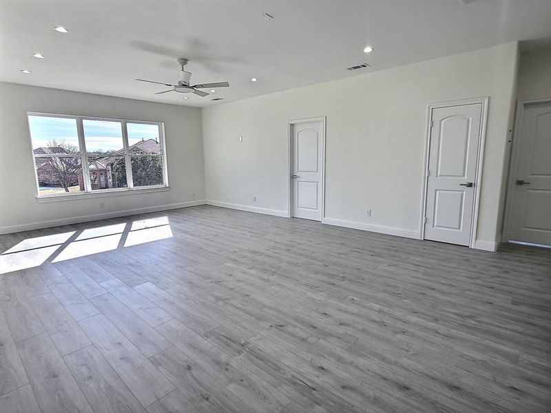 Game room with ceiling fan and light hardwood / wood-style flooring