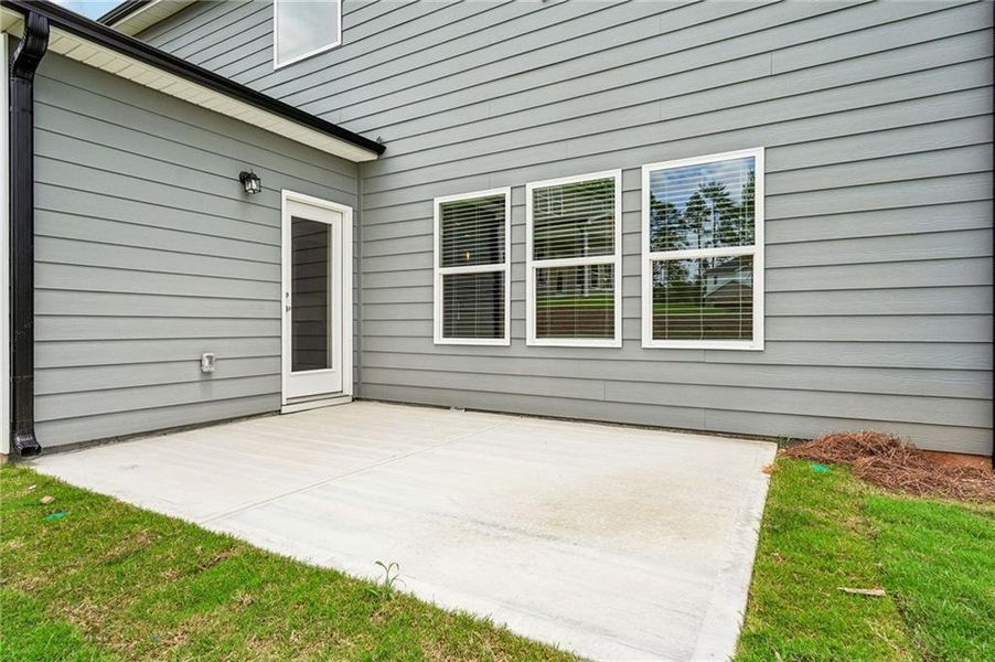 Exterior details and patio area of a home in Northwoods at Mirror Lake, Villa Rica (Image 3).