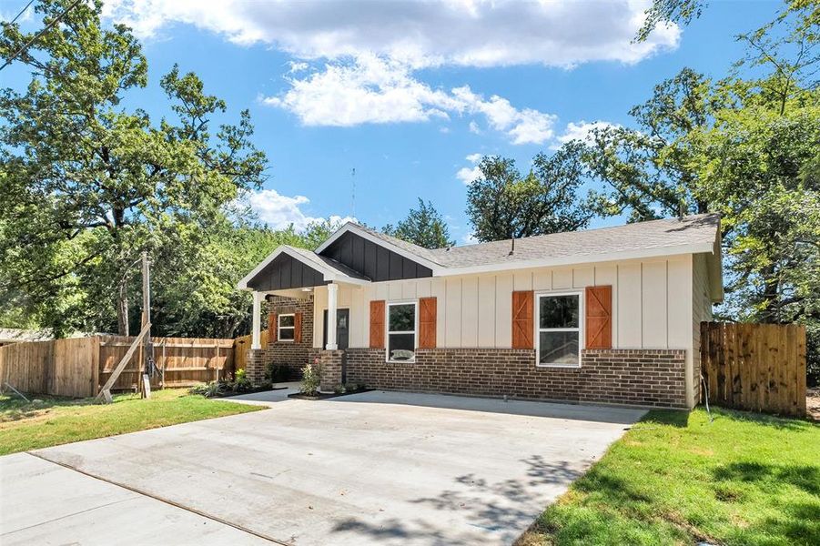 Contemporary exterior featuring brick and board-and-batten siding Contemporary exterior featuring brick and board-and-batten siding