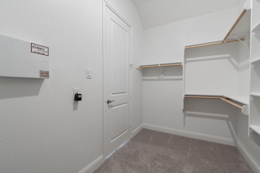 Walk-In Closet | Concept 2406 at The Meadows in Gunter, TX by Landsea Homes