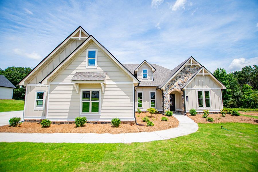 Front exterior of a new home in WOODMONT RESERVE, Roopville, GA, highlighting curb appeal (Image 31).