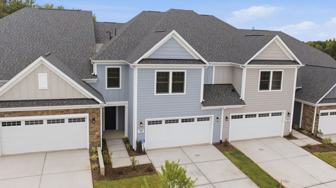 Front exterior of a new home in The Courtyards at Oak Grove, Durham, NC, highlighting curb appeal (Image 27).
