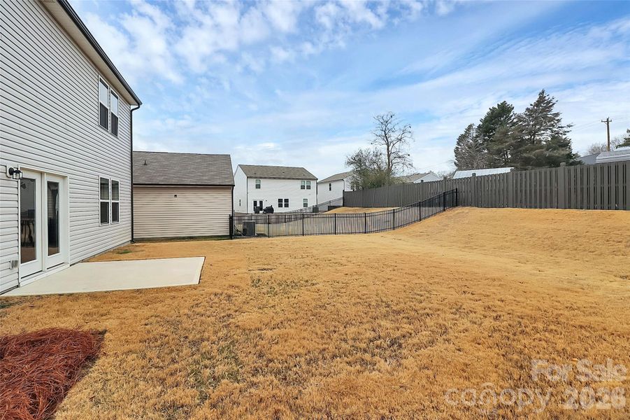 Exterior details and patio area of a home in Sunbriar, Charlotte (Image 27).