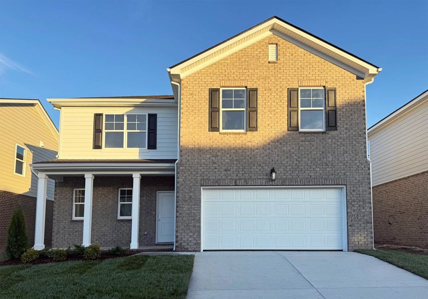 Front exterior of a new home in Cades Bluff, Lebanon, TN, highlighting curb appeal (Image 1). Front exterior of a new home in Cades Bluff, Lebanon, TN, highlighting curb appeal (Image 1).