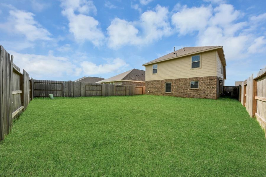 Fully fenced backyard with room to enjoy.