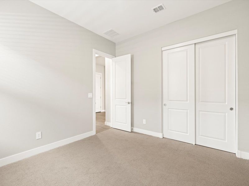 Spacious, unfurnished interior of a new home in White Tank Foothills Reserve Series, Waddell (Image 21).