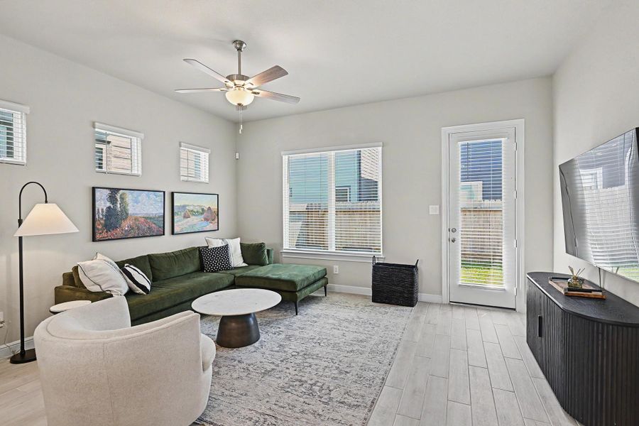 Natural light fills the family room, with direct access to the backyard just steps away. Natural light fills the family room, with direct access to the backyard just steps away.