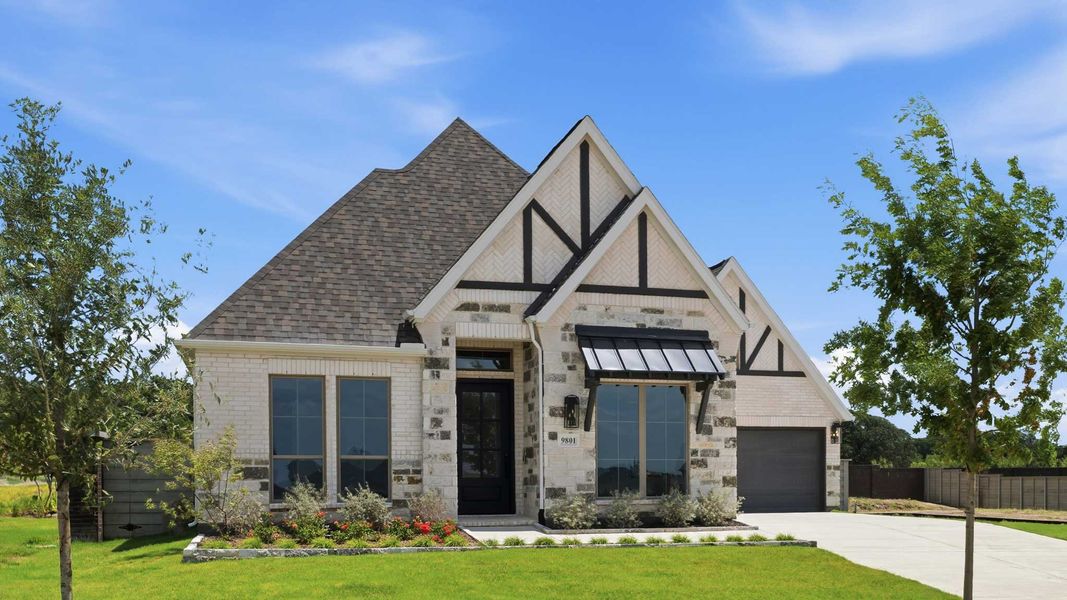 Front exterior of a new home in Landmark, Denton, TX, highlighting curb appeal (Image 1). Front exterior of a new home in Landmark, Denton, TX, highlighting curb appeal (Image 1).