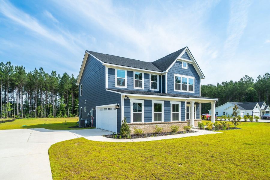Front exterior of a new home in , Ridgeville, SC, highlighting curb appeal (Image 2). Front exterior of a new home in , Ridgeville, SC, highlighting curb appeal (Image 2).