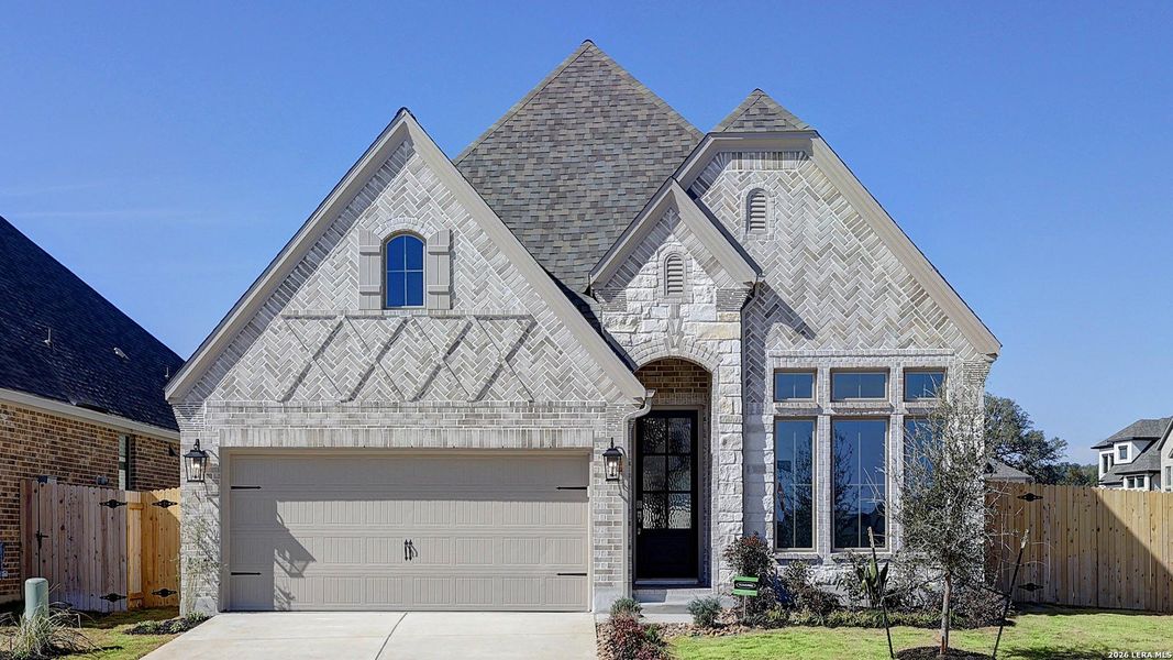 Front exterior of a new home in Kallison Ranch, San Antonio, TX, highlighting curb appeal (Image 2). Front exterior of a new home in Kallison Ranch, San Antonio, TX, highlighting curb appeal (Image 2).