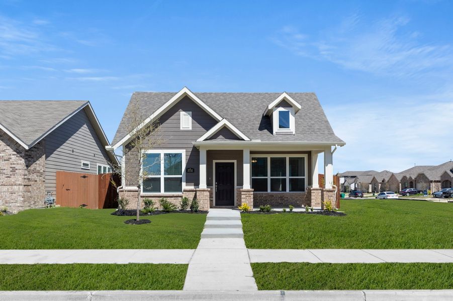 Front exterior of a new home in Heartland, Crandall, TX, highlighting curb appeal (Image 1). Front exterior of a new home in Heartland, Crandall, TX, highlighting curb appeal (Image 1).
