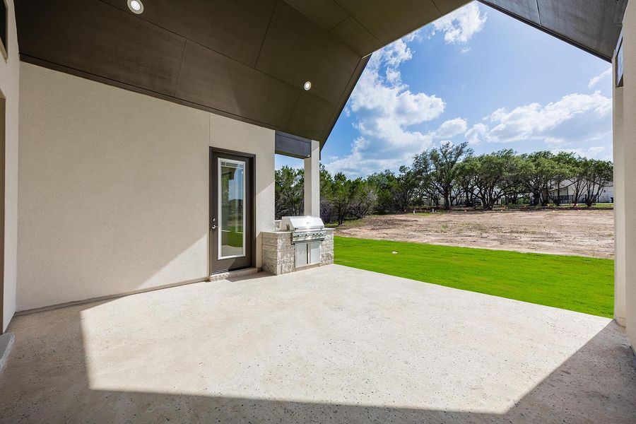 View of patio with an outdoor kitchen