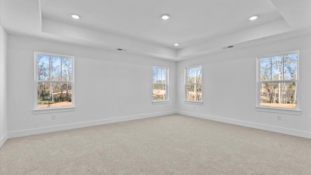 Primary suite that offers first-rate relaxation with established style and elevated finishes