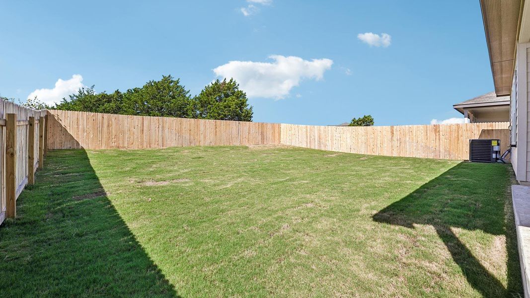 Exterior details and patio area of a home in Carillon, Manor (Image 3).