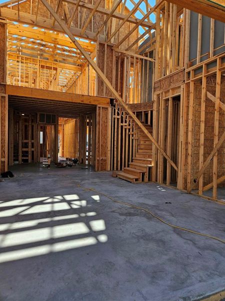 View from covered patio into the family room and dining area.