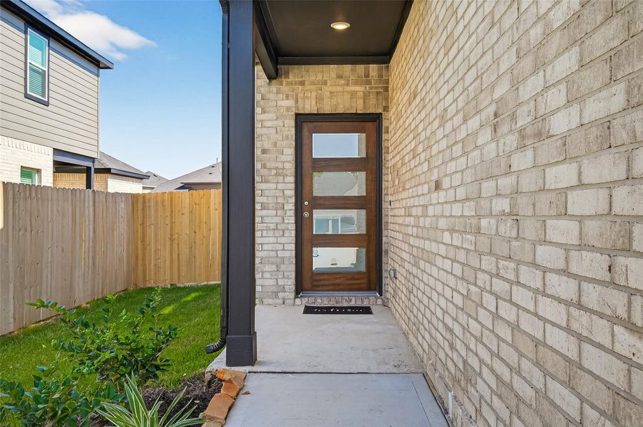 Exterior details and patio area of a home in Mill Creek Trails, Magnolia (Image 4).