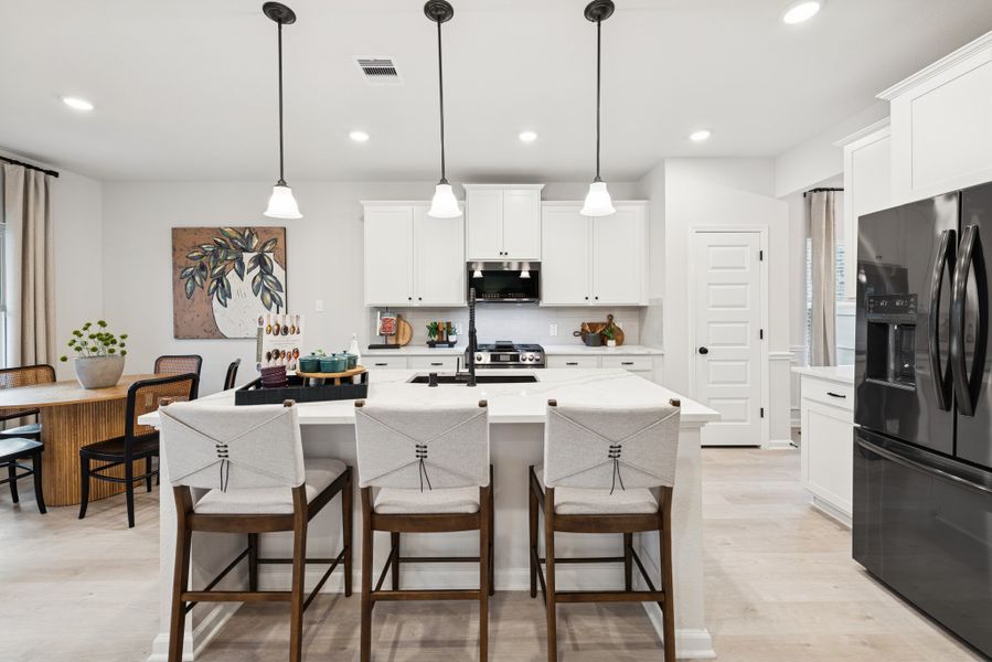 The Princeton II- Kitchen and Breakfast Area. Staged model home shown for illustration only; actual features, colors, and upgrades may vary. The Princeton II- Kitchen and Breakfast Area. Staged model home shown for illustration only; actual features, colors, and upgrades may vary.