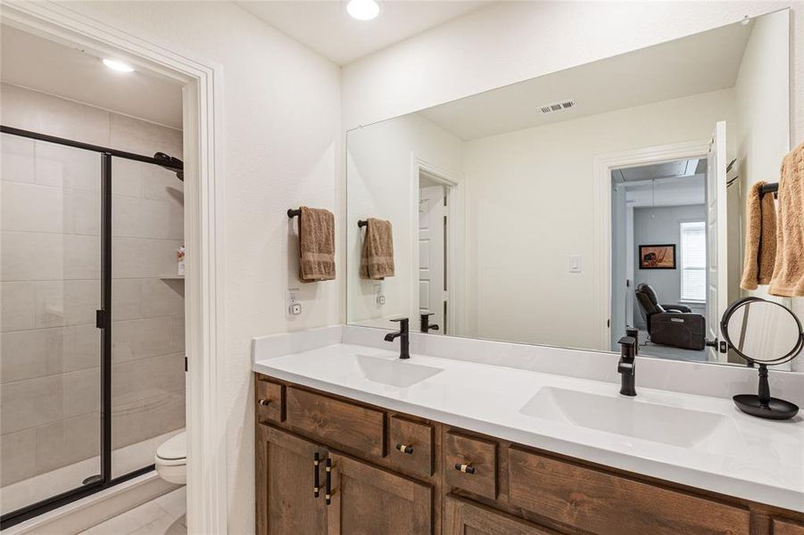 Second Level Bathroom with Dual Sinks and a Shower
