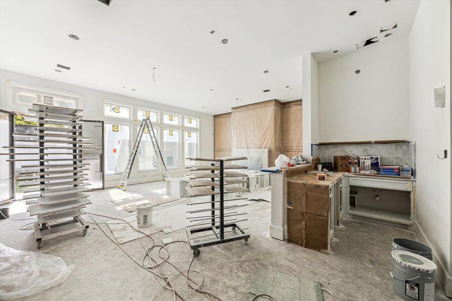 Wet bar area is to the right of the picture.  Stunning waterfall countertop and backsplash will accent this entertaining hub beautifully.  Construction as of 10/29