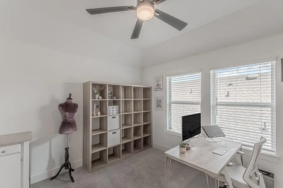 This spacious upstairs bedroom is currently being used as a study.