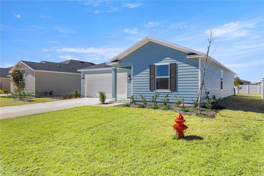 Front exterior of a new home in Marion Ranch, Ocala, FL, highlighting curb appeal (Image 5).