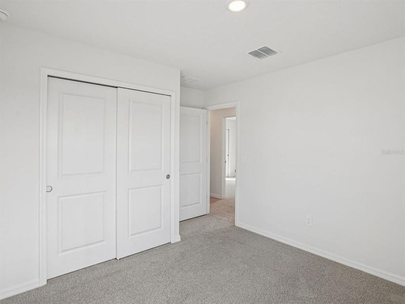 Spacious, unfurnished interior of a new home in The Grove at Stuart Crossing - Classic Series, Bartow (Image 38).