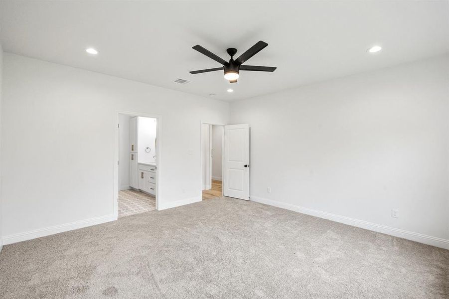 Unfurnished bedroom featuring recessed lighting, visible vents, light carpet, and baseboards